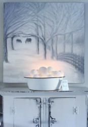 a metal bathtub with lit up snowballs and a tag is a fun rustic decoration for any winter space