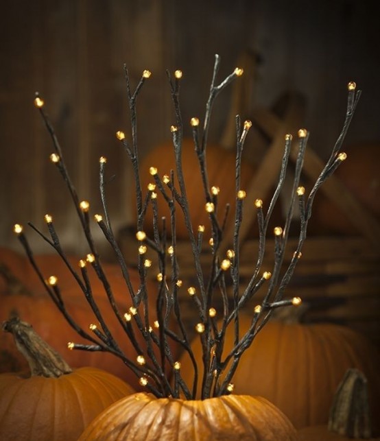 a pumpkin with light up twigs is a cool and easy fall decoration you can make anytime