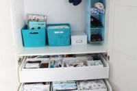 drawers for storage, some boxes and an open storage unit in various bright colors to organize kids’ clothes