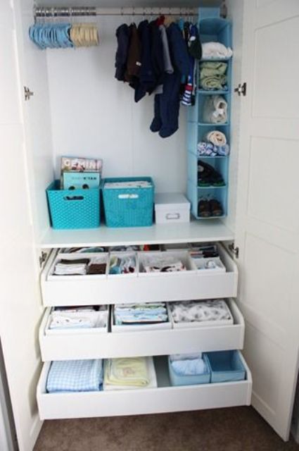 drawers for storage, some boxes and an open storage unit in various bright colors to organize kids' clothes