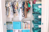 a closet with lots of hangers and a storage units with open compartments and drawers