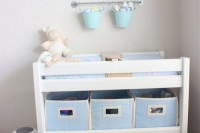 a simple changing table done with fabric boxes and baskets as drawers is an eay way to organize