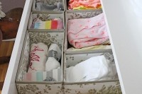 organize a drawer with fabric boxes to store the clothes and other stuff with comfort