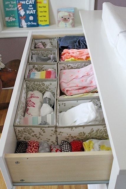 organize a drawer with fabric boxes to store the clothes and other stuff with comfort