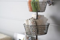 a stand with wire baskets is a nice idea for storage, place it on your changing table