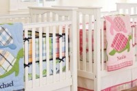 a neutral shared nursery with neutral furniture, shutters and colorful printed bedding to accent the spaces