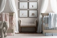 an all-neutral shared nursery with neutral furniture, artworks and toys and blue and pink linens to accent each baby’s space