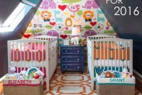 a colorful shared nursery with chalkboard walls, a colorful accent wall, bright bedding and lots of toys