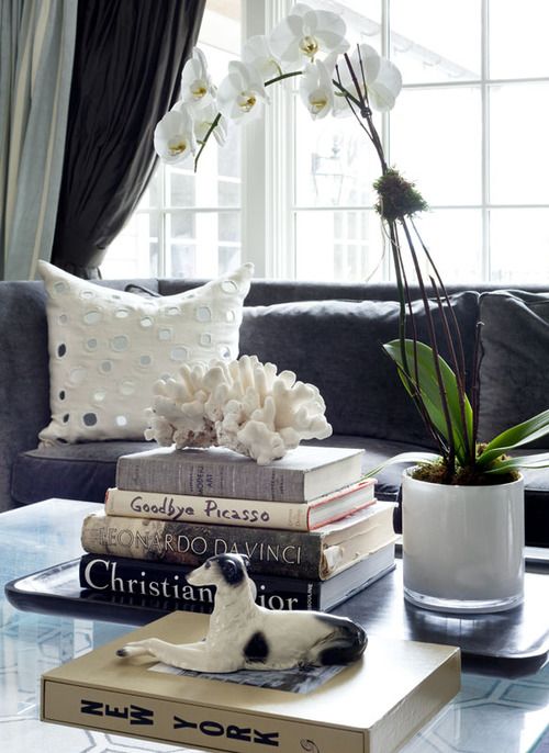 corals on top of stack of books is a lovely idea for a refined and cool coastal interior, and is easy to compose