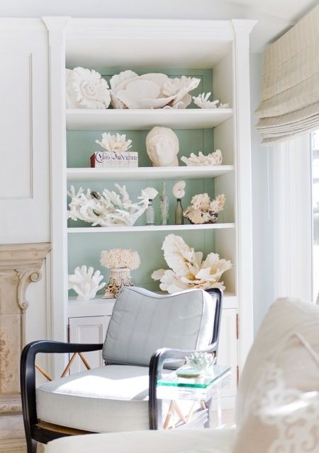 an outdoor storage unit filled with seashells and corals is a gorgeous solution that will scream seaside and seas