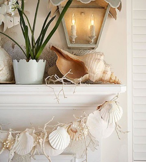 A giant seashell, corals and a garland of seashells and starfish will make your mantel very beach like and holiday inspired