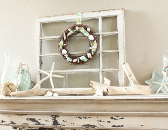 starfish, rope balls, aqua bottles and star plates, a wreath with seashells and starfish for making your mantel beach-like