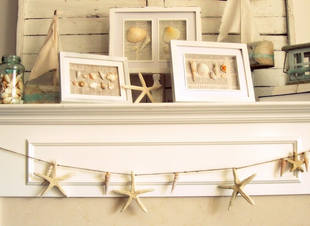 A neutral beach mantel with seashell artworks, starfish and a jar with seashells, a garland of starfish for a vacation inspired mantel