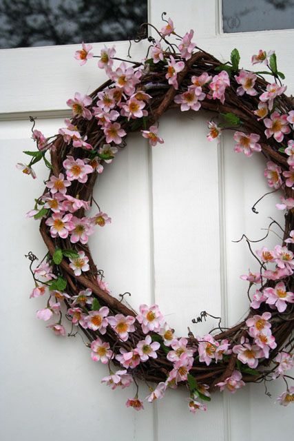 A vine and cherry blossom wreath will make your front door look very spring like and very chic
