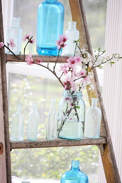 a blue jar with pink cherry blossom is a cool decoration to place it anywhere
