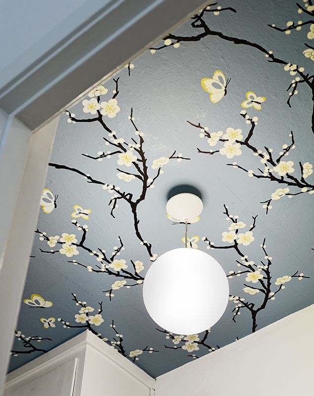 Blooming branches on the ceiling make the space feel spring like and very tender and fresh