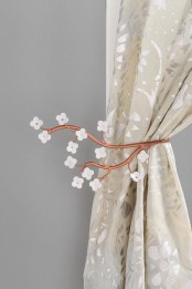 stylized cherry blossom branches as curtain holders – a little and cute accessory to spruce your home for spring