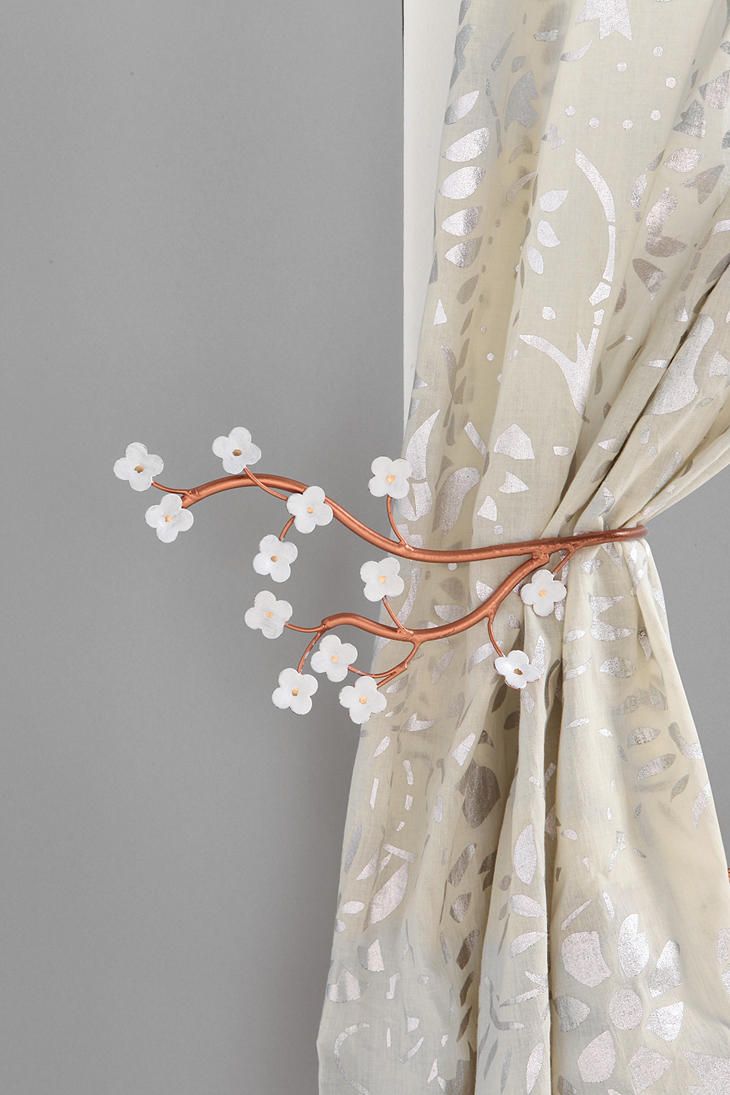 Stylized cherry blossom branches as curtain holders   a little and cute accessory to spruce your home for spring