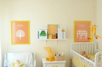 a warm-colored shared space done with touches of yellow, with artworks, toys and some bright bedding