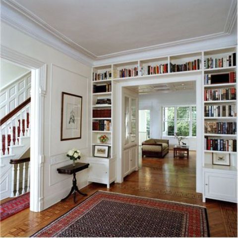 A doorway with built in shelves is a smart solution to store all the books and give a touch of style to the room at the same time