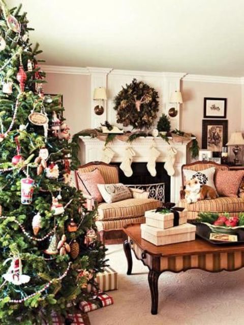 A row of stockings, a fir garland, a lush fir wreath, a Christmas tree with various vintage inspired ornaments for creating a mood