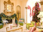 a refined and neutral Christmas living room with bold holiday decor – a colorful ornament garland, a Christmas tree with lights and bright ornaments, white deer figurines is lovely