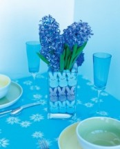 a simple Easter centerpiece of bunnies and purple grape hyacinths