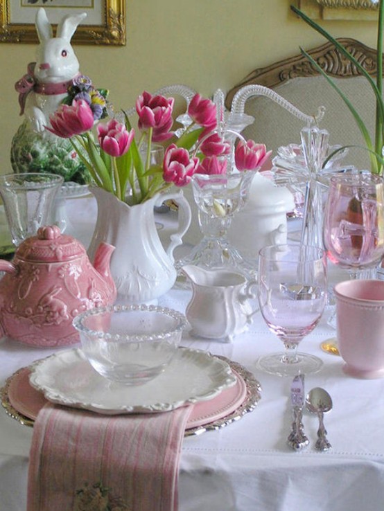 an Easter tablescape with white porcelain, pink teaware and napkins, some bold pink tulips and a bunny is a very cool idea for spring and Easter