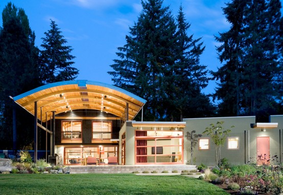 House Made Of Eclectic Materials with Arched Metal Roof