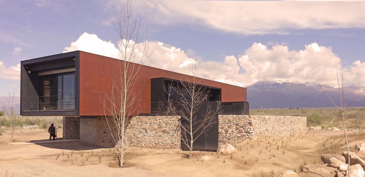 Edgy modern andes house wrapped in a rusty metal shell  3