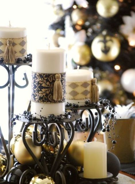 Exquisite vintage Christmas decor   black candelabras, gold ornaments, black beads and candles wrapped with chic pieces and tassels is lovely