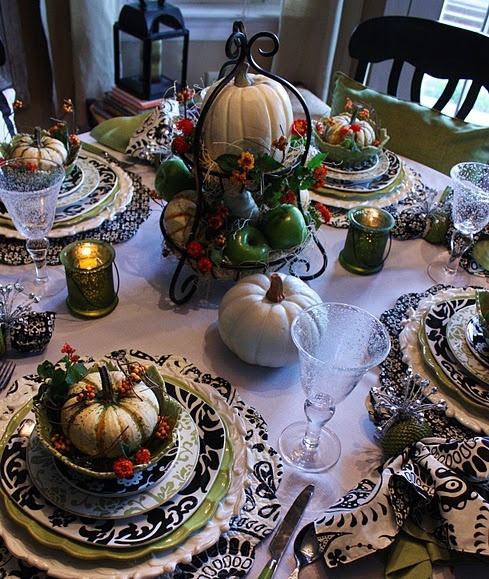 a black and white Thanksgiving tablescape refreshed with green touches is done in vintage style and feels classic and bold