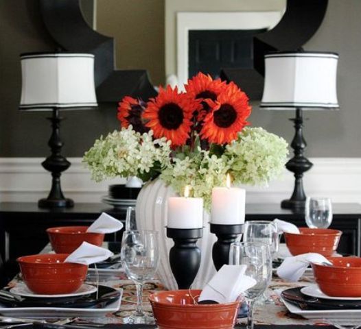 A traditional black and white Thanksgiving tablescape made bolder with red touches   bowls and blooms   looks cool and bright