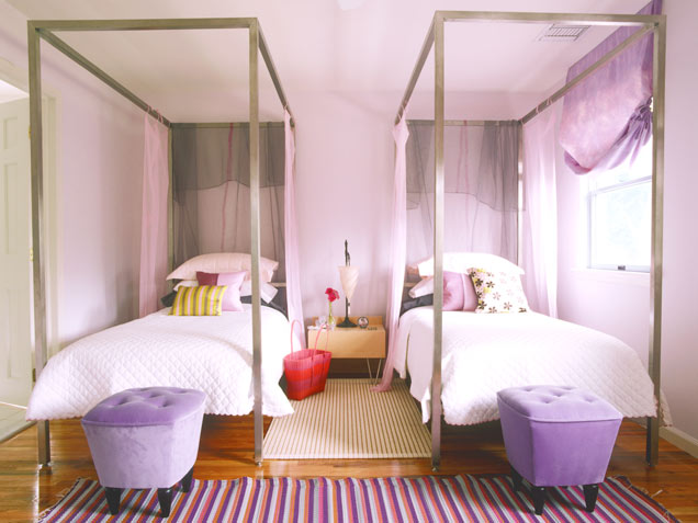 Elegant feminine room in shades of violet. Nice beds and bedside poufs make it look quite unique.
