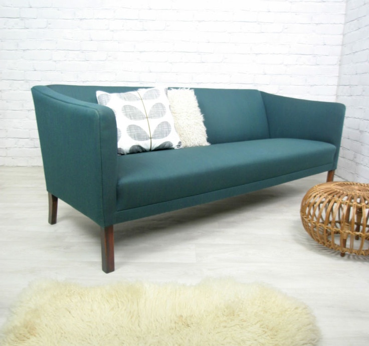 A blue mid century modern sofa is a catchy and bold addition to any living room, it's a stylish and timeless solution