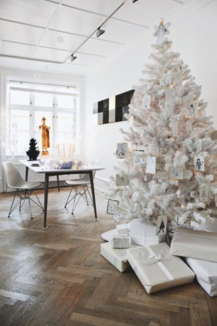 a white Christmas tree and penguin ornaments and lights needs no special decor, it's beautiful and chic itself