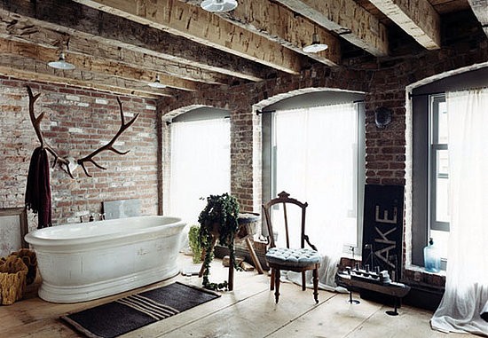 Bathroom with an exposed brick wall should feature a free-standing tub so you could the beautify of the whole wall.