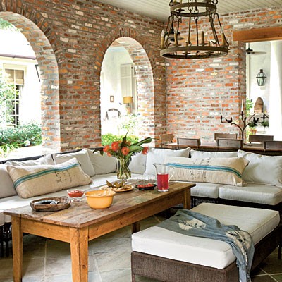 For outdoor areas like patios leaving exposed bricks is even more natural.