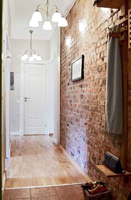 Sealed brick walls are perfect for a hallway because of their durability.