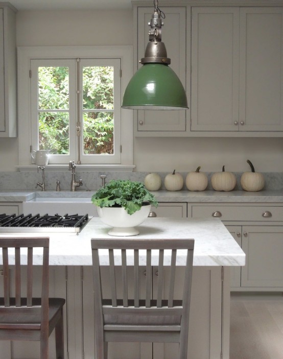 white pumpkins placed on your kitchen table will give a cozy rustic feel to your space