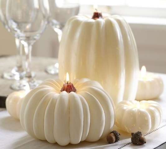 large and small white pumpkin candles look very unusual and very cool and they will refresh your interior for the fall