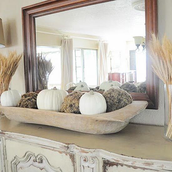 A dough bowl with moss balls and white pumpkins is a great all natural decoration for the fall