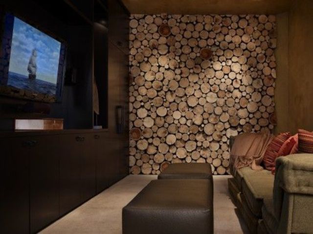 A wood slice accent wall makes the living room rustic and cozy and hides a non working fireplace at the same time