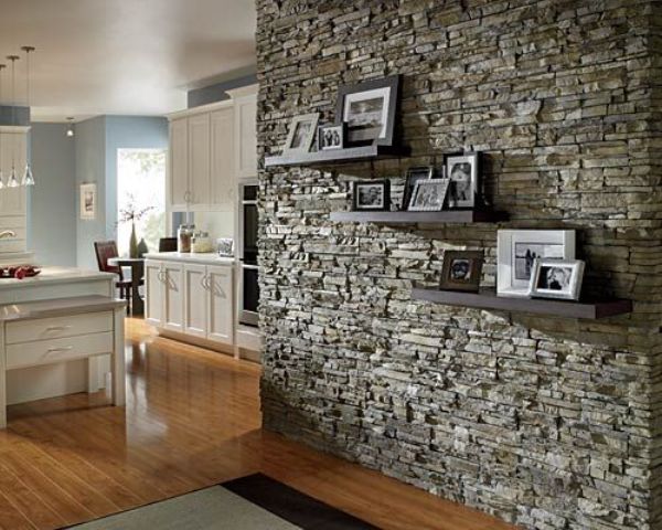 A textural stone accent wall adds interest and eye cathciness to the vintage inspired space in white and light blue