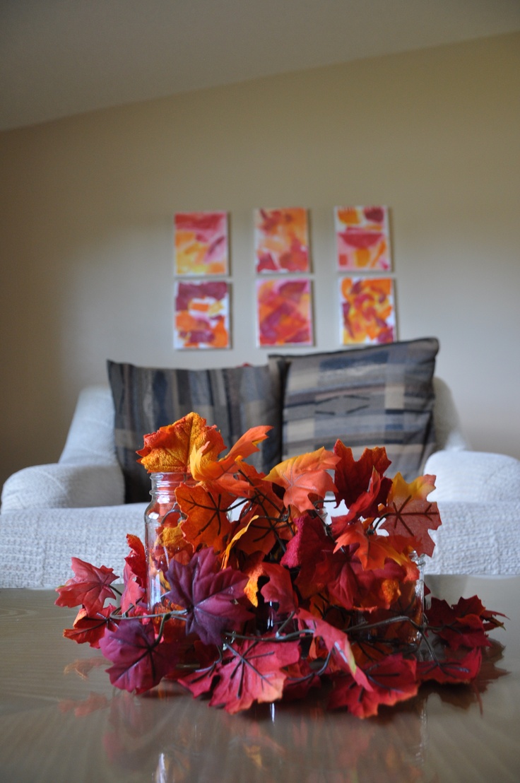 An arrangement of super bright faux fall leaves is all you need to bright a strong fall feel to the space