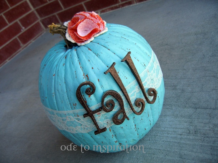 A blue pumpkin with a lace ribbon, quirky letters and bright fabric blooms on top is very fun and chic