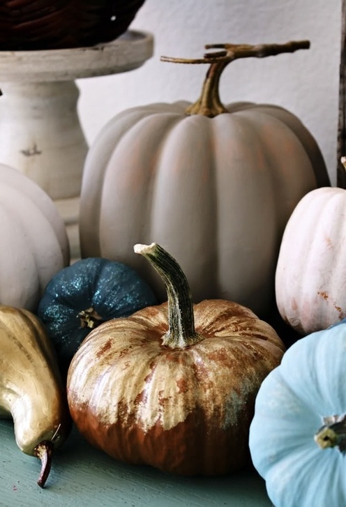 shiny gold, blue and blush pumpkins and gourds look cool and modern, they don't hint on anything rustic
