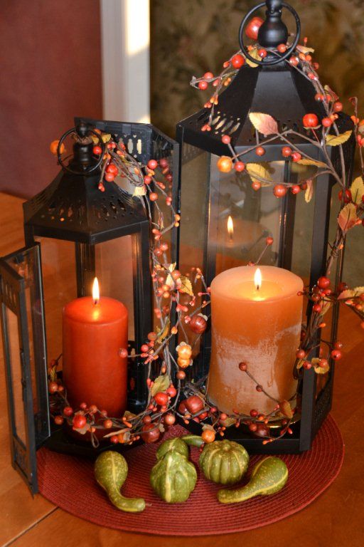 You can connect several lanterns in one centerpiece with several twigs with berries.