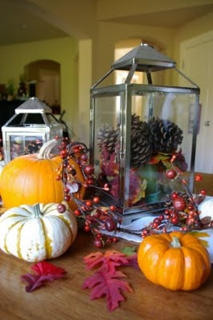 If their size allows, stuff you lanterns with pinecones. They would become great additions to any arrangements.