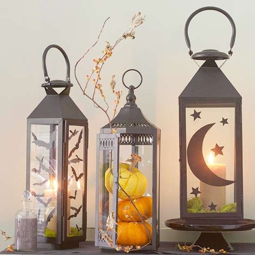 Cut a bunch of silhouettes and glue them to lanterns to make a great piece of decor for Halloween.